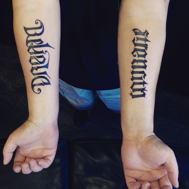 Me and my sister both had this tattoo (Ambigram) placed on our wrists. When  arm stretched out straight, reads 